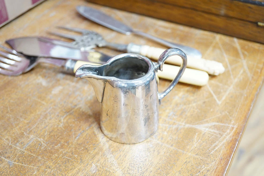 A quantity of assorted plated items including entrée dishes, flatware and mugs.